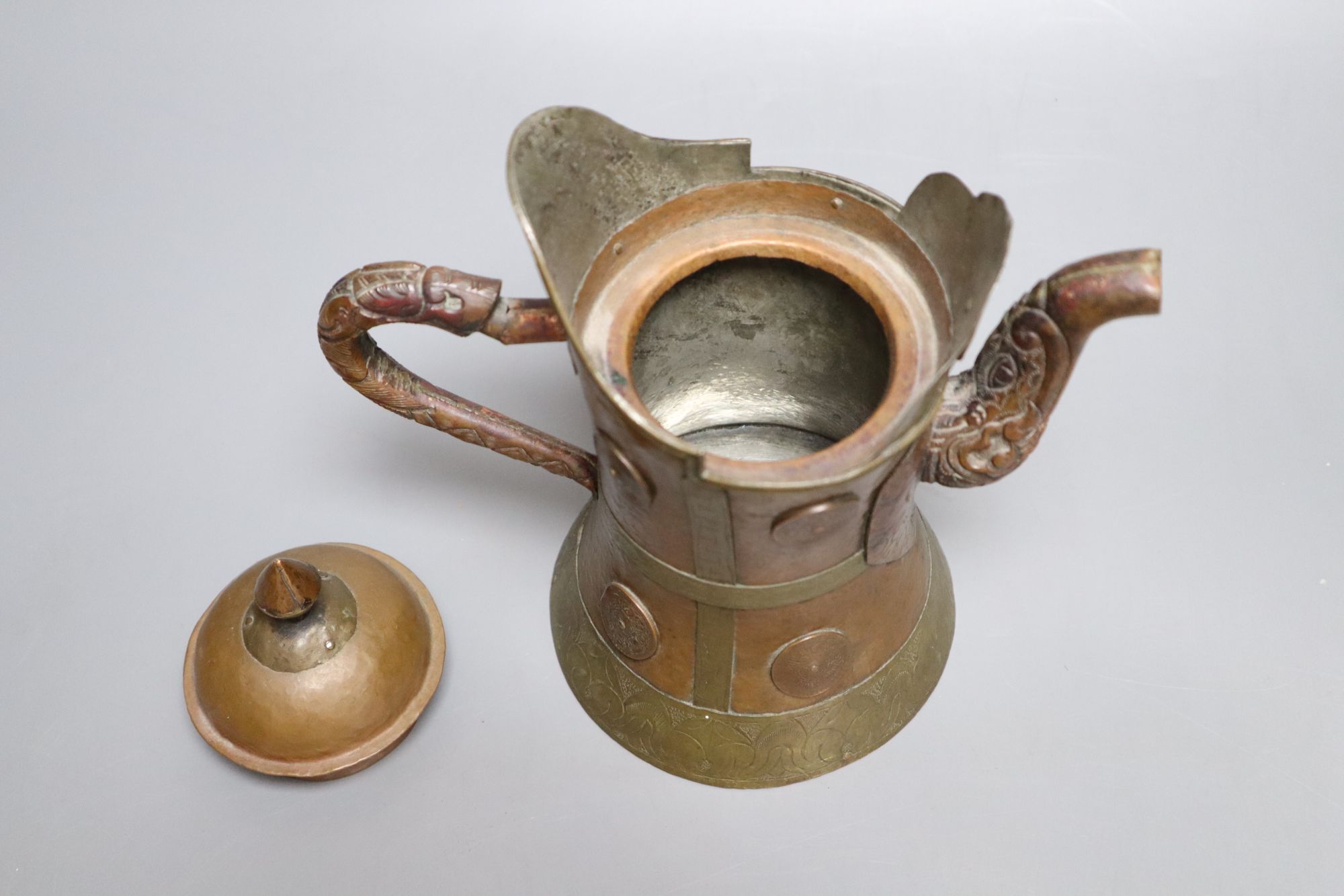 A Himalayan copper and brass teapot, height 20cm